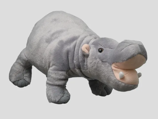 A hippopotamus plush against a white background