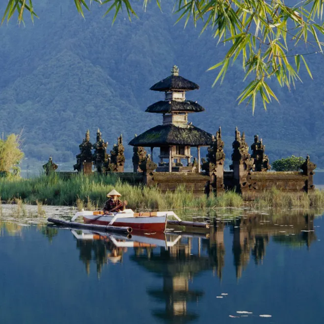 A tiered building next to water