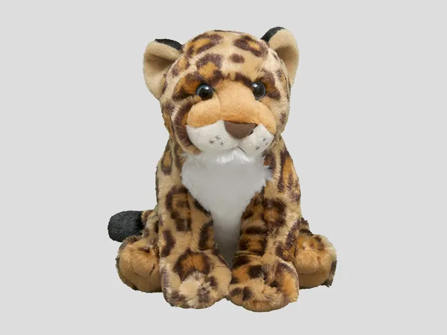 A spotted jaguar plush against a gray backgrouns
