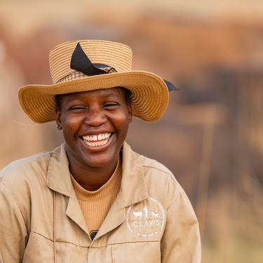 A farmer smiles at the camera