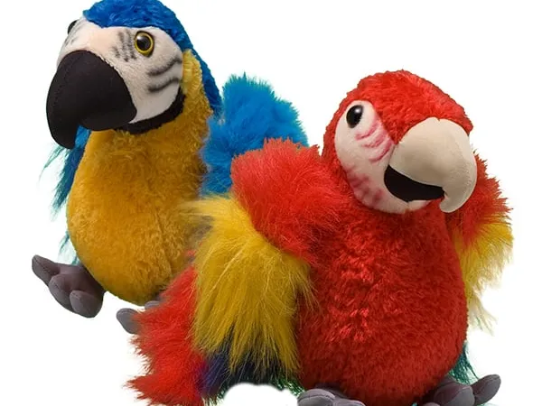 A red and blue macaw plush against a white background.
