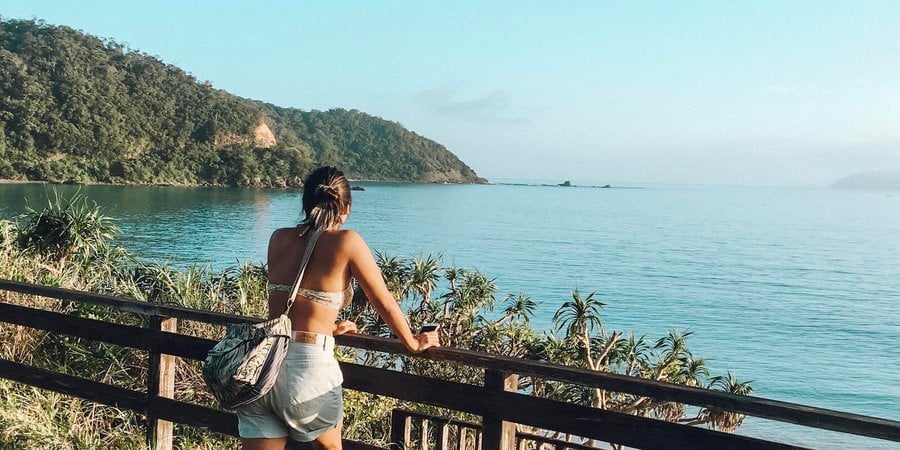 Ellie Yanagisawa looks out across a beach on Amami in the morning.