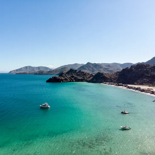 Aerial photo of ocean cove with boats