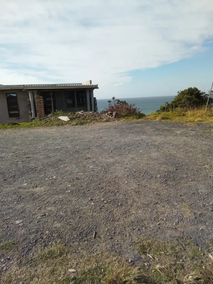 A damaged building on the edge of the sea