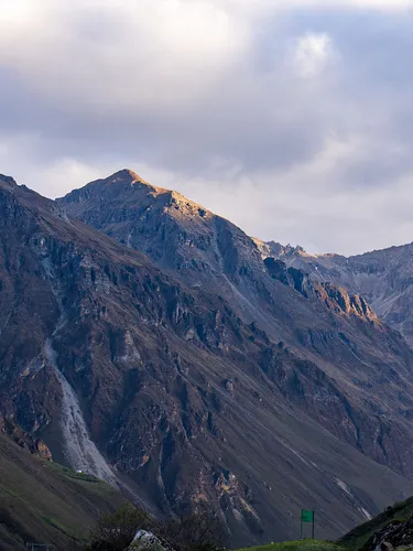 Tall peaks of the Himalayan Mountains in Bhutan on a cloudy day