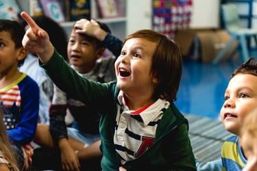 Student pointing at a screen