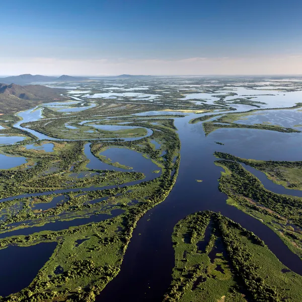 Aerial view of the Pantanal Matogrossense National Park with Amolar Mountain Ridge in the background. on a sunny day