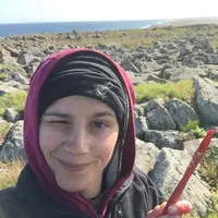 Alexis Will with rocks and water in background