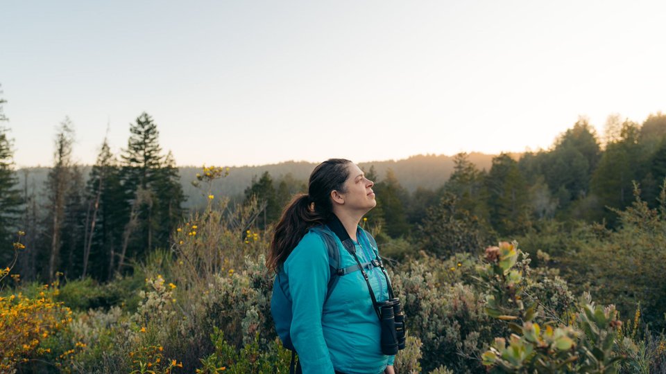 Annika Terrana stands in a meadow
