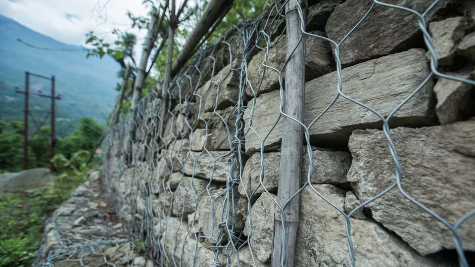 A stone wall reinforced by wire