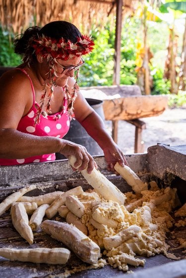 A woman prepares food outdoors