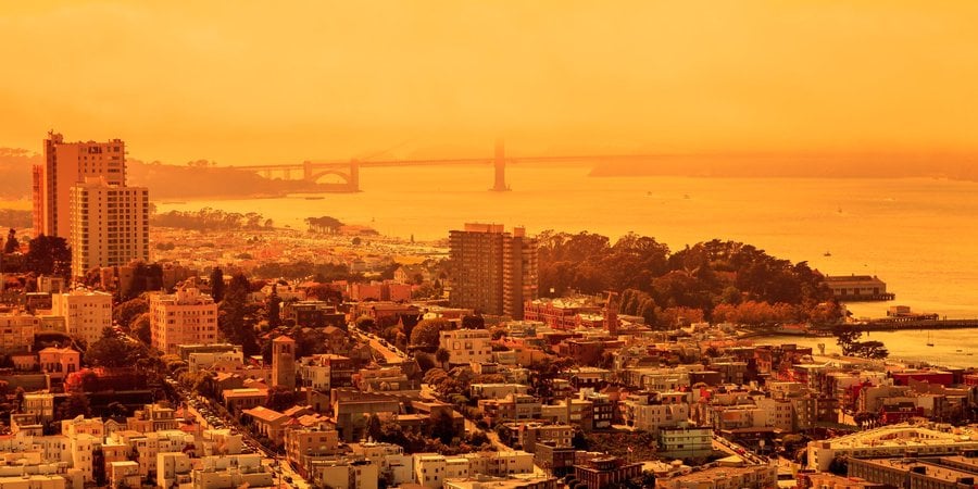 Buildings surrounded in an orange glow.
