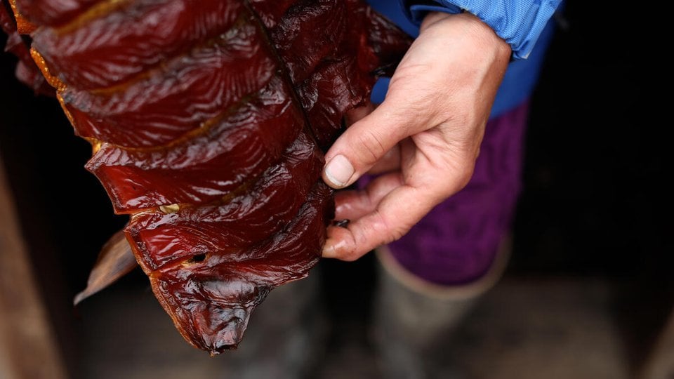 CarolAnn Hester in Naknek, Alaska. Hester prepares and cans salmon for the winter. She practices subsistence fishing.