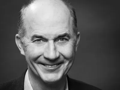 A headshot of Carter Roberts smiling at the camera