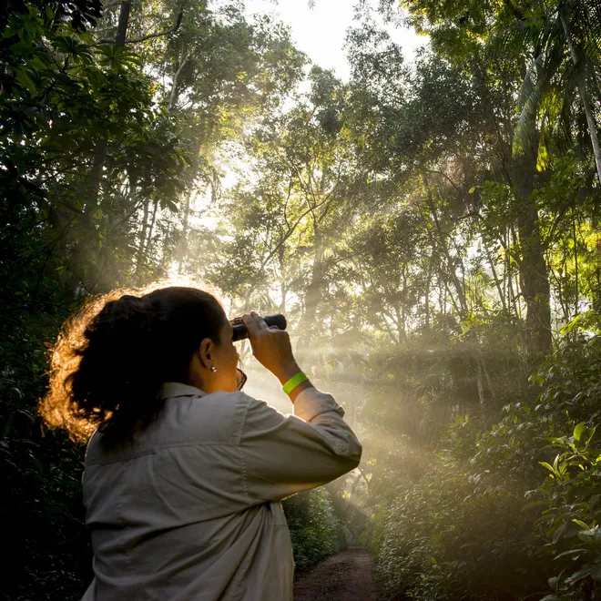 Woman looking through binoculars