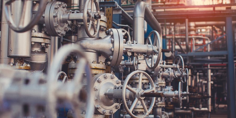 Close up of pipes and valves in a factory