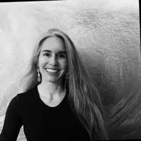 Black and white photograph of woman with long blonde hair smiling