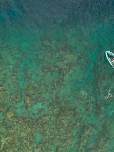 A diving skiff about to anchor at a reef north of Vanua Levu, Fiji