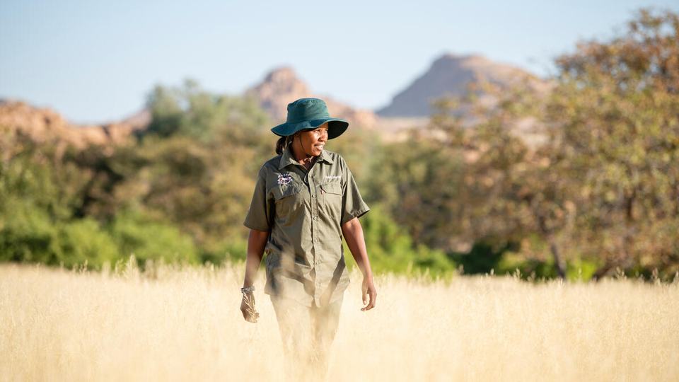 Rhino ranger Erlyn Touros looks for rhino tracks in the Uibasen Twyfelfontein Conservancy, Namibia