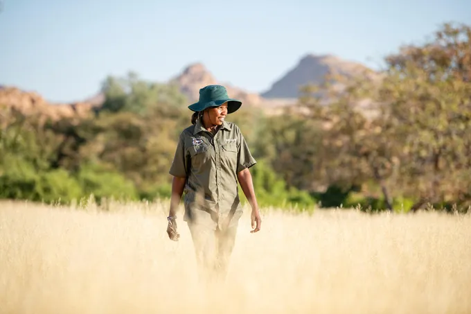 Rhino ranger Erlyn Touros looks for rhino tracks in the Uibasen Twyfelfontein Conservancy, Namibia
