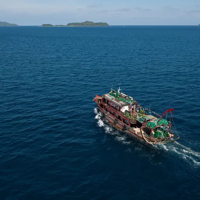 A fishing ship crossing deep blue water