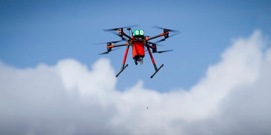 drone flying and delivering bait