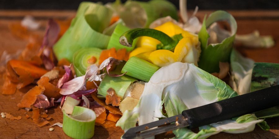 A color photo showing leftover food scraps on a table.