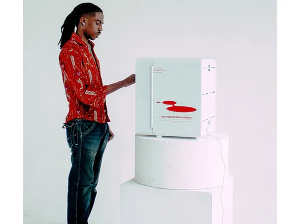 A person stands next to a soap refill station