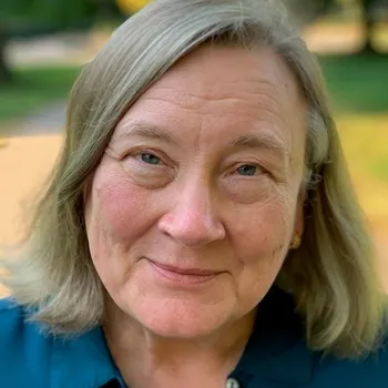 Headshot of Virginia smiling.