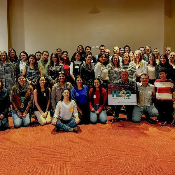 Diverse group of people posing for photo.