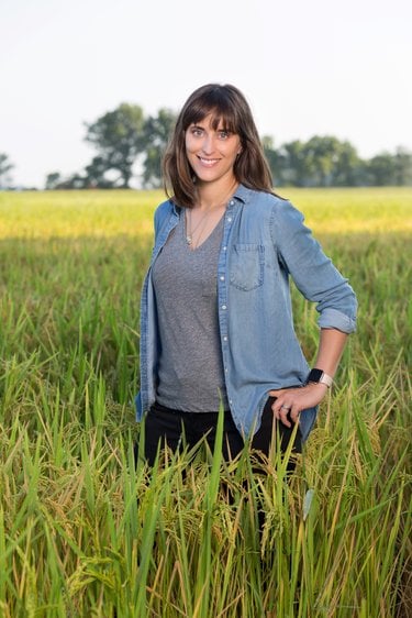 Hallie Shoffner stands in a field