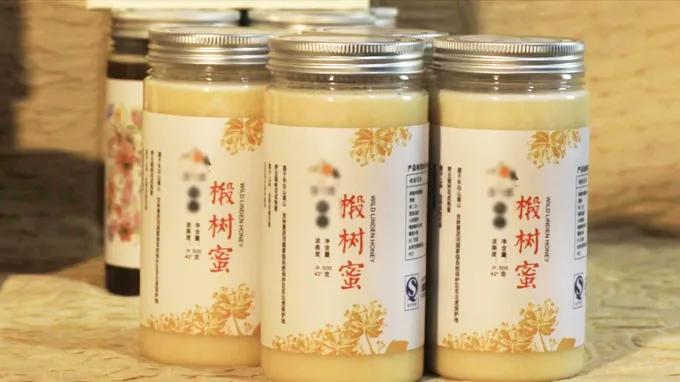 Jars of local honey sitting on a table