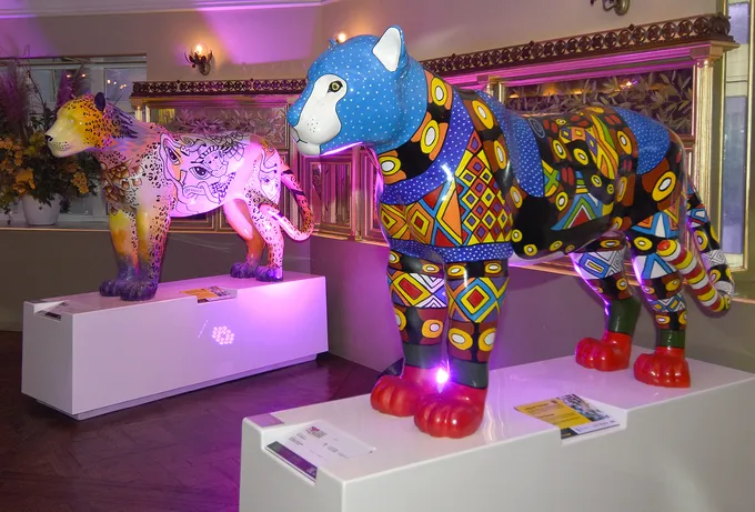 Models of jaguars in plaster and colorfully decorated on display for a jaguar parade.