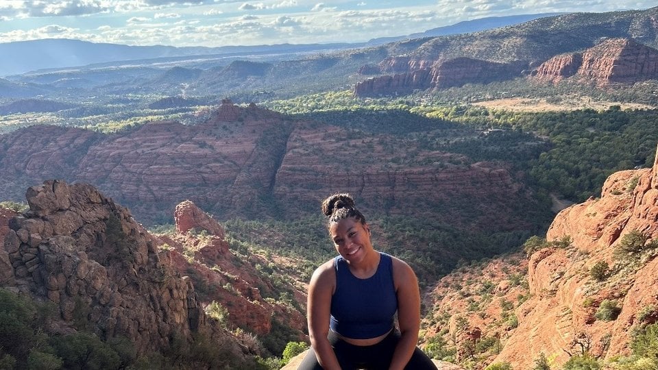 Jessica Beal in front of red hills and canyons