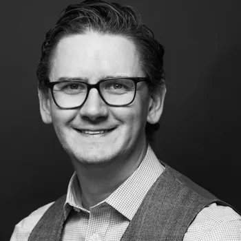 A black and white headshot of Johan.