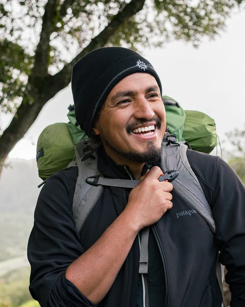 A photo of Jose Gonzalez, founder of Latino Outdoors, enjoying a backpacking trip