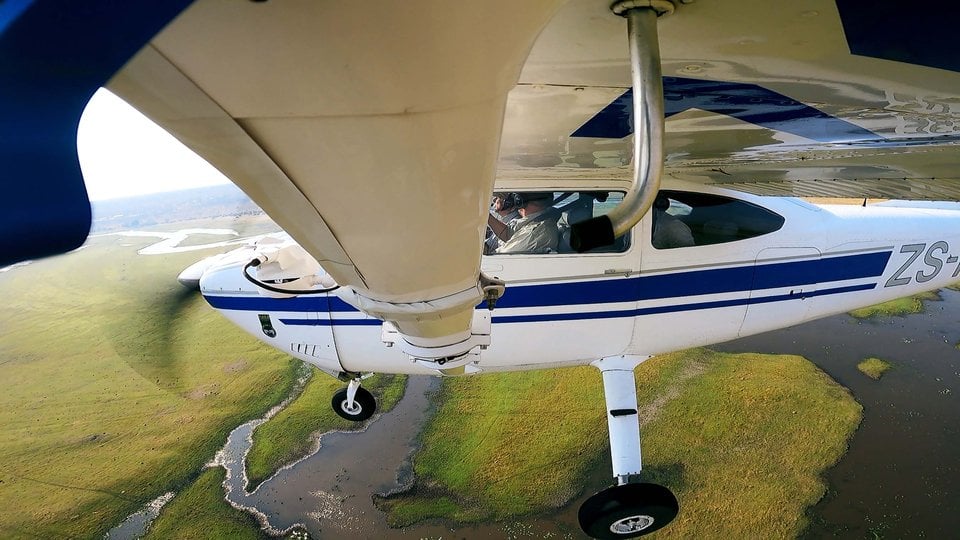 Photo of small plane taken from wing during flight