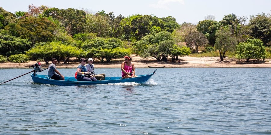Visitors on a canoe trip led by Kumaruara leader