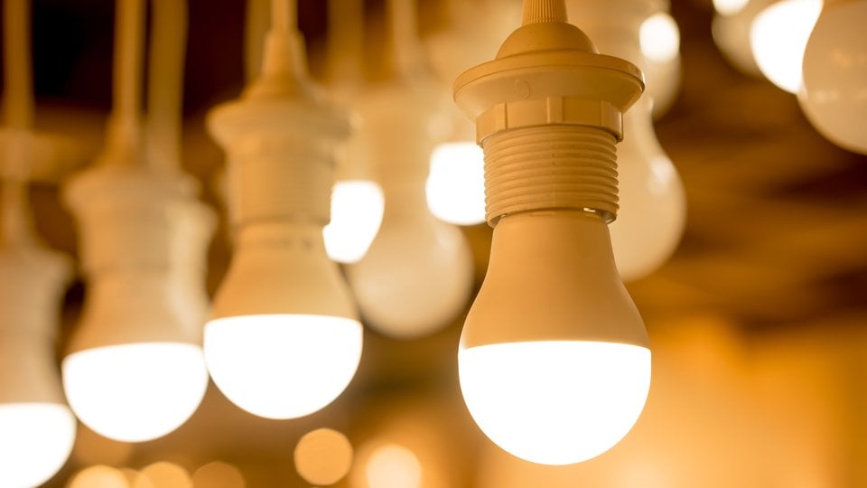 An LED light is in the foreground with a number of other LED lights blurred in the background