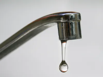 A faucet dripping water