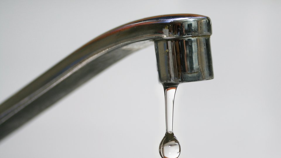 A faucet dripping water