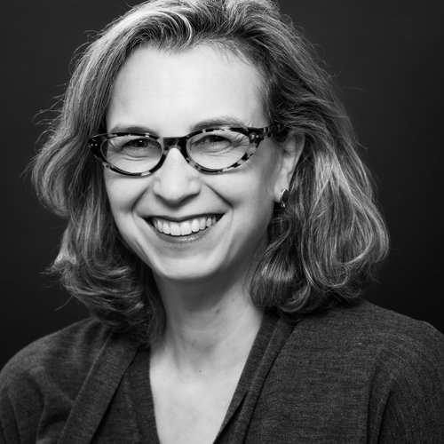 A black and white headshot of Loren.