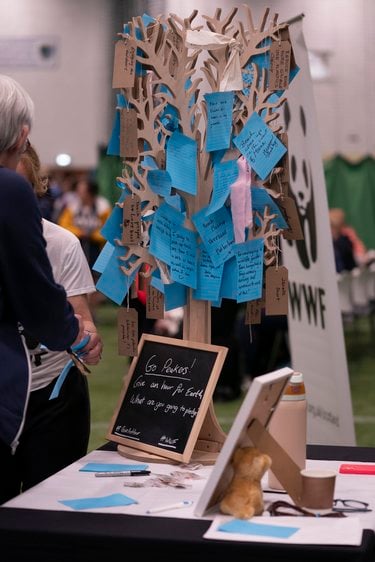 A paper tree with pledges attached and a WWF banner