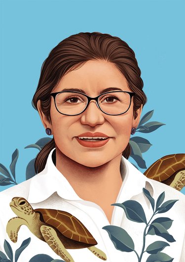 An illustration of a woman with dark hair and glasses wearing a shirt with leaves and a turtle.