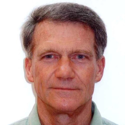 A close-up headshot of a man's face