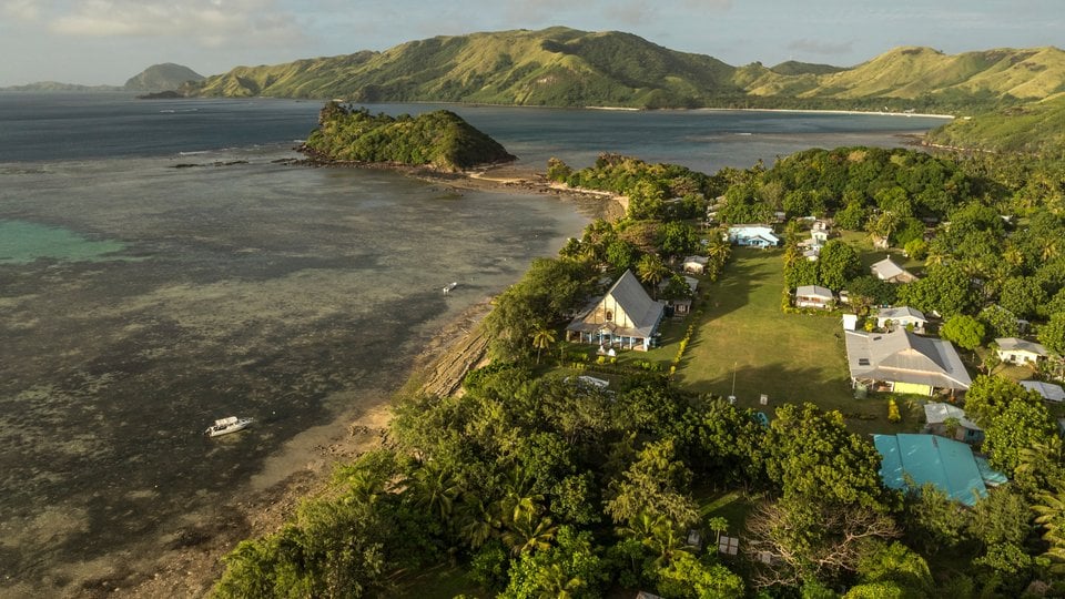 aerial view of houses along coast of Nacula Village, Yasawa Islands, Fiji