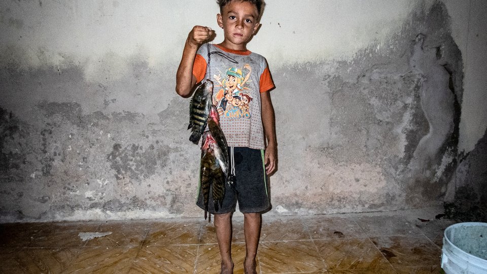Boy holding fish