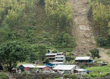 Village at the bottom of a large hill