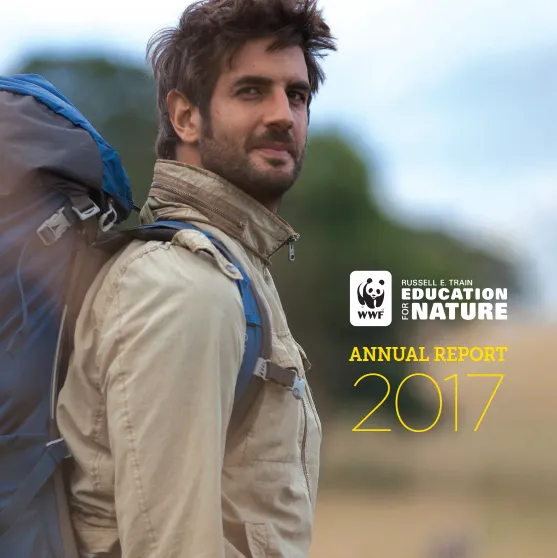 A report cover with a man wearing a tan shirt and blue and black backpack looking beyond the camera