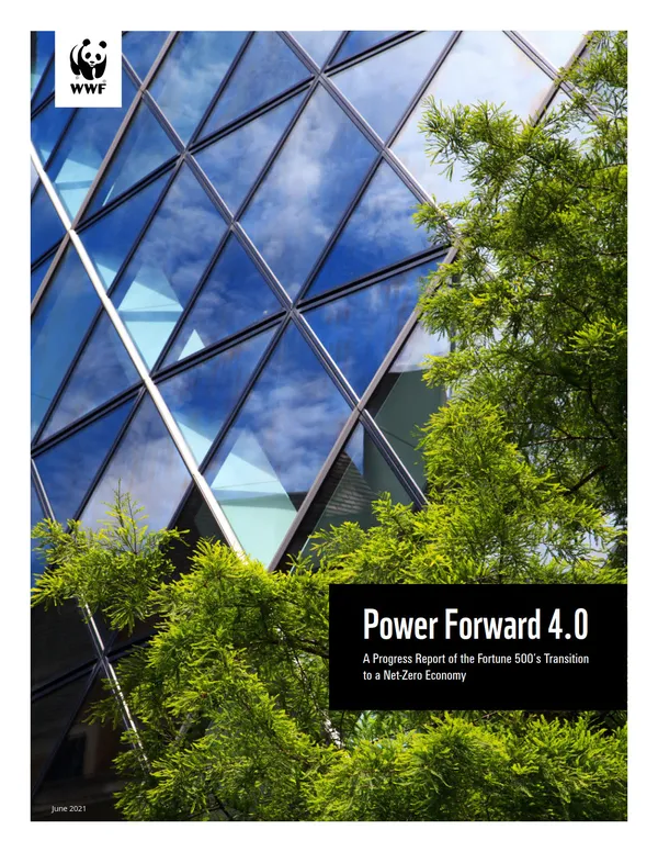 A report cover showing greenery and the blue glass of a building